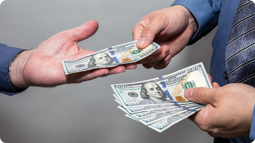 Someone handing another person money